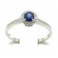 Solitaire ring in 18kt gold with sapphire and diamonds